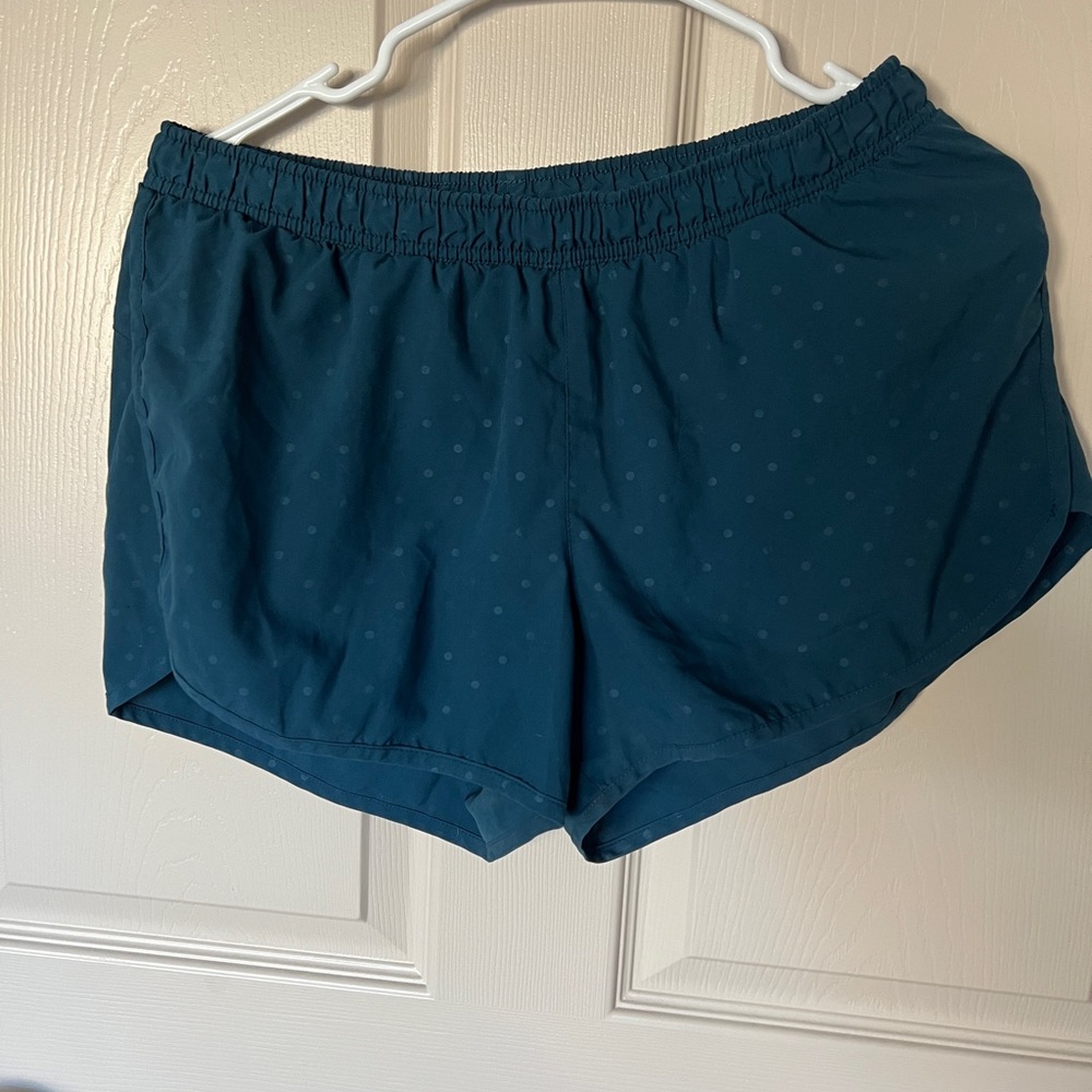 Blue running shorts with light polka dots